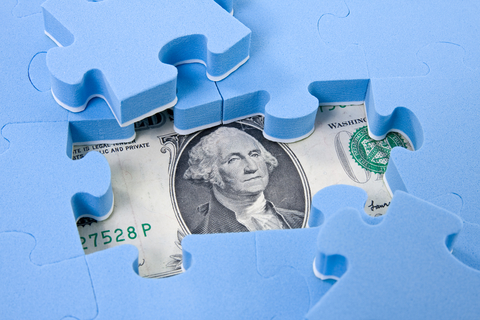 puzzle pieces and dollar bill illustrating hidden assets