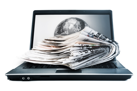 Laptop and print newspapers
