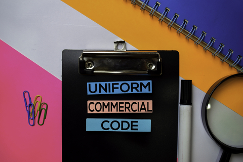 Clipboard with Uniform Commercial Code written on it