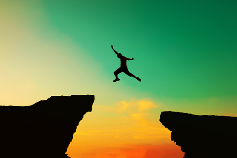 jumping over an abyss to show taking a leap of faith